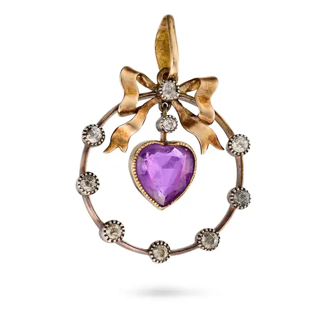 AN ANTIQUE AMETHYST AND DIAMOND HEART PENDANT the pendant designed as a bow set with old cut