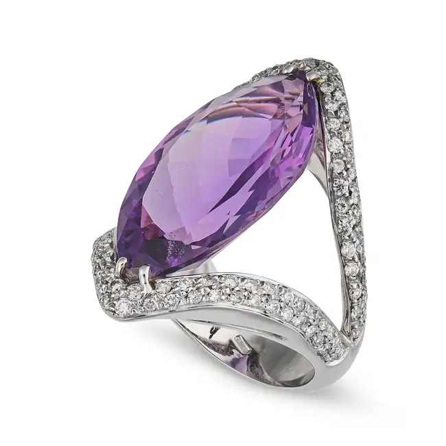 SALAVETTI, A FINE AMETHYST AND DIAMOND DRESS RING in 18ct white gold, set with a marquise cut
