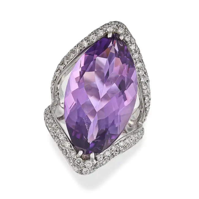 SALAVETTI, A FINE AMETHYST AND DIAMOND DRESS RING in 18ct white gold, set with a marquise cut