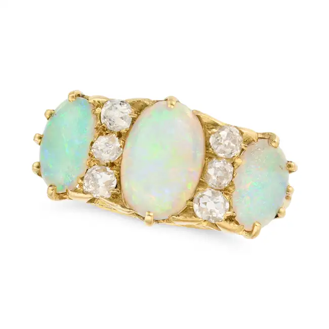 AN ANTIQUE OPAL AND DIAMOND RING in 18ct yellow gold, set with three cabochon opals accented by
