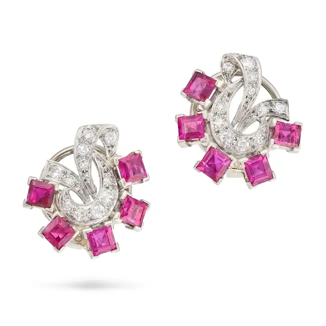 A PAIR OF RETRO RUBY AND DIAMOND EARRINGS each in scrolling design, set with square step cut