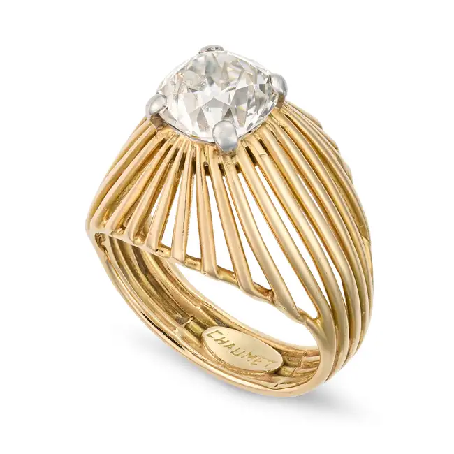 CHAUMET, A FINE VINTAGE DIAMOND DRESS RING in 18ct yellow gold and platinum, set with an old cut