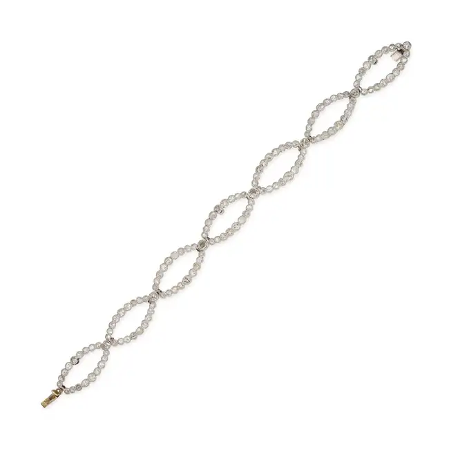 AN ANTIQUE DIAMOND TIARA / BRACELET, EARLY 20TH CENTURY in platinum and 18ct yellow gold, comprising