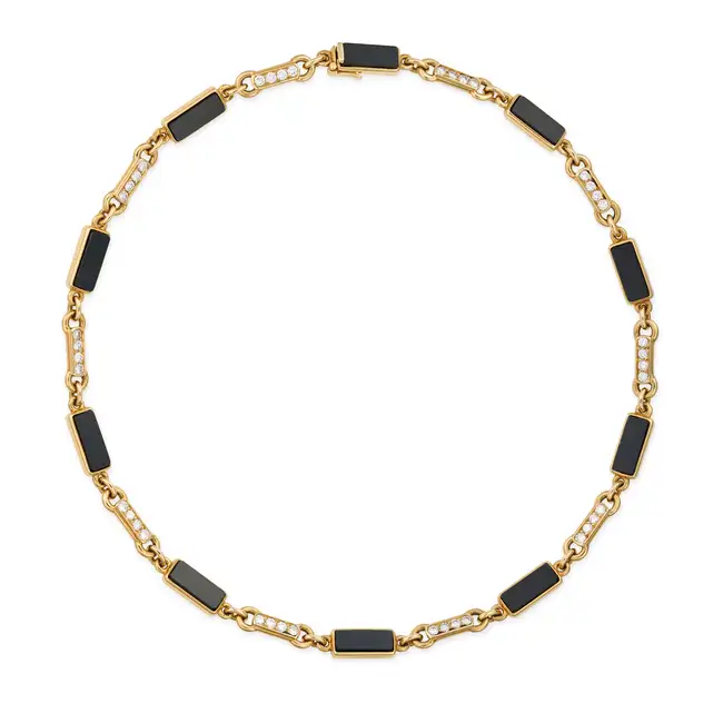 VAN CLEEF & ARPELS, A FINE ONYX AND DIAMOND CHOKER NECKLACE, 1960's in 18ct yellow gold, set with