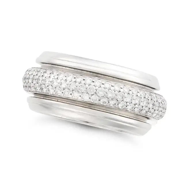 PIAGET, A DIAMOND POSSESSION SPINNING RING, 1998 the band with an articulated central row of pave