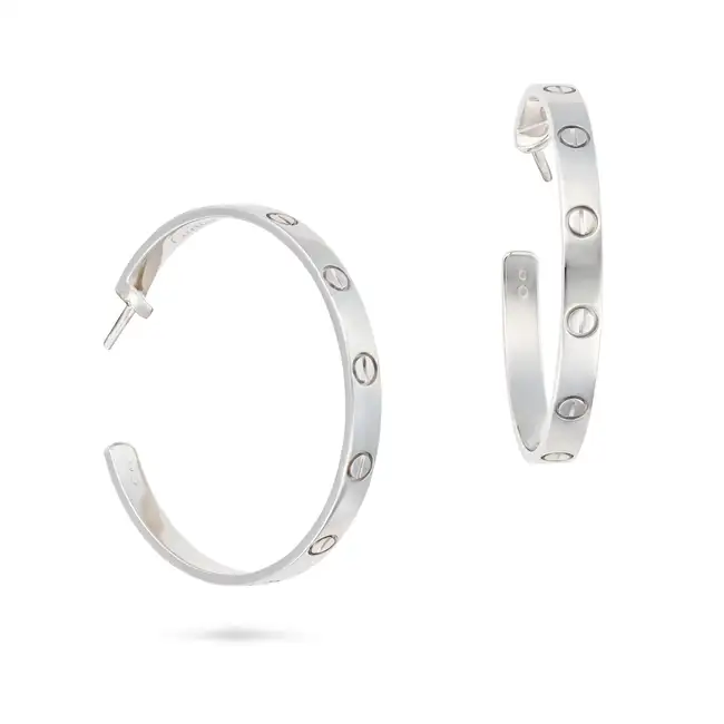 CARTIER, A PAIR OF LOVE HOOP EARRINGS in 18ct white gold, each hoop punctuated by screw head motifs,