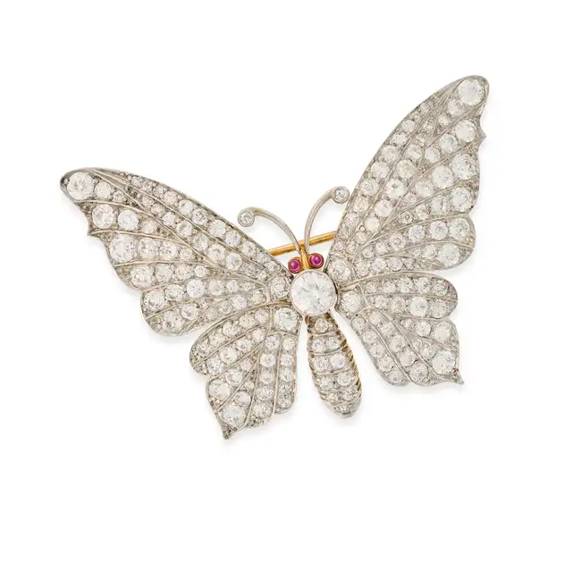 TIFFANY & CO., A VINTAGE DIAMOND AND RUBY BUTTERFLY BROOCH designed as a butterfly, set throughout