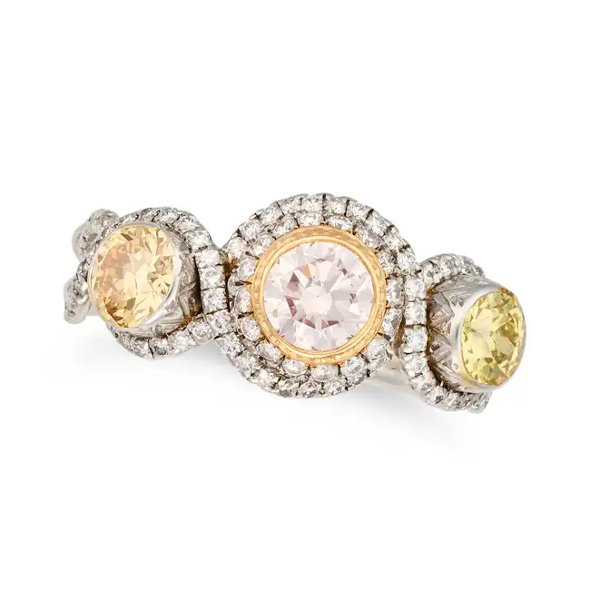 A FANCY COLOURED DIAMOND DRESS RING set with a round brilliant cut fancy light pink diamond of 0.