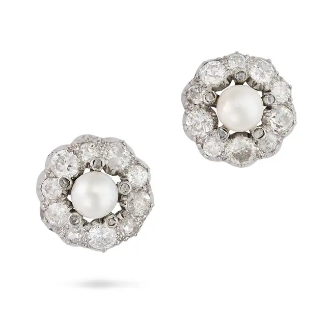 A PAIR OF PEARL AND DIAMOND CLUSTER EARRINGS each set with a pearl of 6.5mm within a cluster of