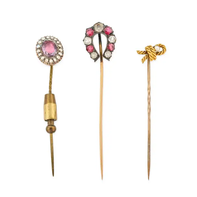 NO RESERVE - A COLLECTION OF FOUR ANTIQUE STICK PINS comprising a paste horse shoe stick pin 1.