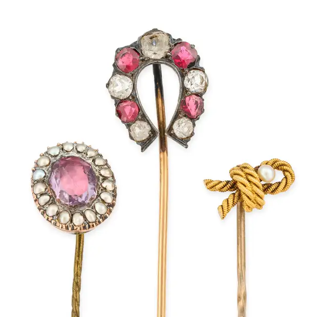 NO RESERVE - A COLLECTION OF FOUR ANTIQUE STICK PINS comprising a paste horse shoe stick pin 1.
