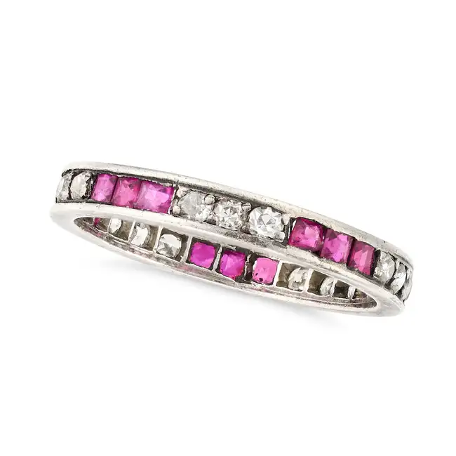 NO RESERVE - AN ART DECO RUBY AND DIAMOND FULL ETERNITY RING set all around with trios of old cut