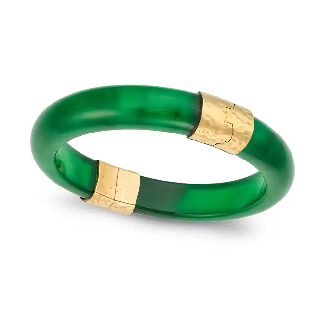 VERNEY, A JADEITE JADE BANGLE in yellow gold, the hinged bangle comprising two segments of