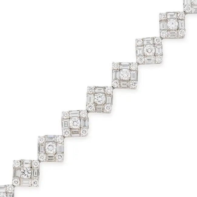 A DIAMOND BRACELET in 18ct white gold, comprising a row of square shaped links set with round