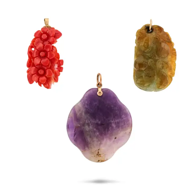NO RESERVE - THREE PENDANTS comprising a carved coral pendant, no assay marks, 3.9cm, a polished