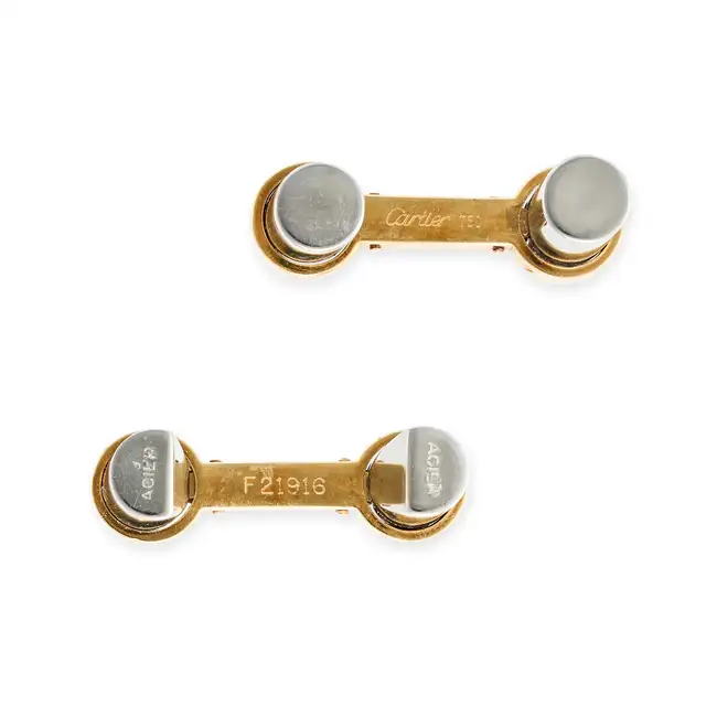 CARTIER, A PAIR OF GOLD AND STEEL CUFFLINKS in 18ct yellow gold and steel, each comprising two steel