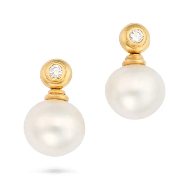 A PAIR OF SOUTH SEA PEARL AND DIAMOND DROP EARRINGS each comprising a pearl drop of 15.7mm suspended