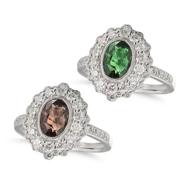 OSCAR FRIEDMAN, AN ALEXANDRITE AND DIAMOND CLUSTER RING set with an oval cut alexandrite of 1.90