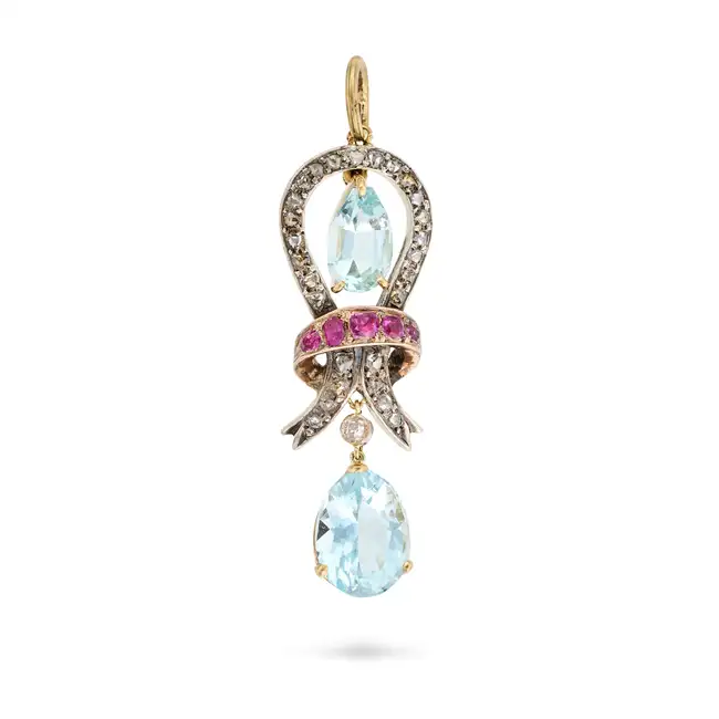 AN ANTIQUE AQUAMARINE, RUBY AND DIAMOND PENDANT designed as a knot set with cushion cut rubies and