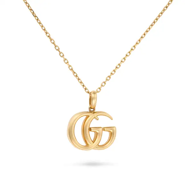 GUCCI, A GOLD PENDANT NECKLACE in 18ct yellow gold,  the pendant designed as a pair of
