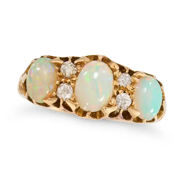AN ANTIQUE EDWARDIAN OPAL AND DIAMOND RING, 1903 in 18ct yellow gold, set with three cabochon opals,