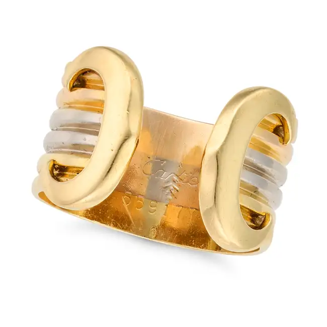 CARTIER, A GOLD C DE CARTIER RING in 18ct yellow, white and rose gold, the open tricolour band