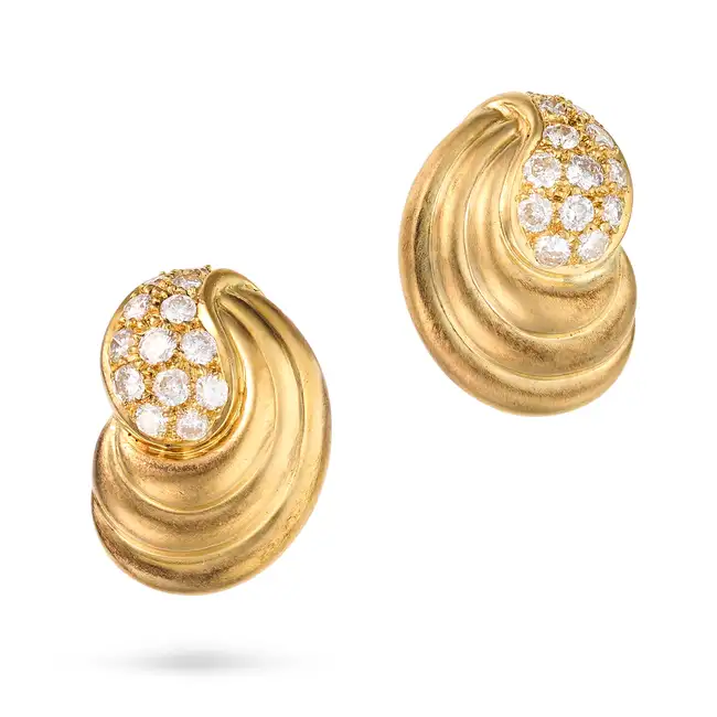 A PAIR OF DIAMOND CLIP EARRINGS in 18ct yellow gold, each in scrolling design, pave set with round