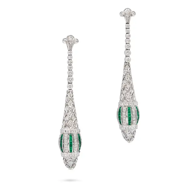 A PAIR OF EMERALD AND DIAMOND DROP EARRINGS the tapering openwork bodies set with round brilliant