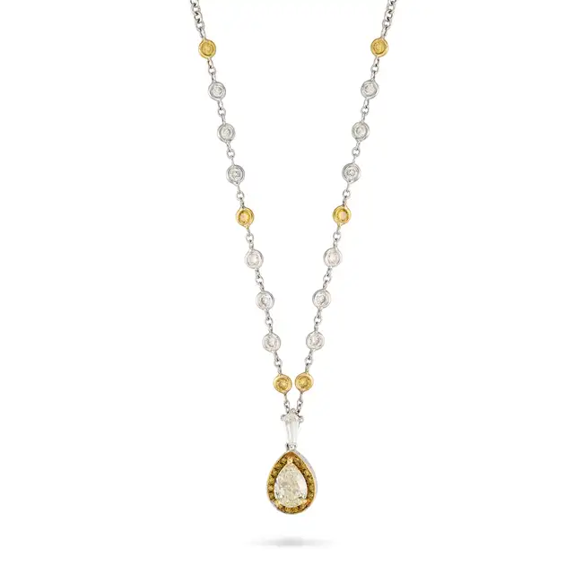 A FANCY LIGHT YELLOW AND WHITE DIAMOND PENDANT NECKLACE in 18ct white and yellow gold and
