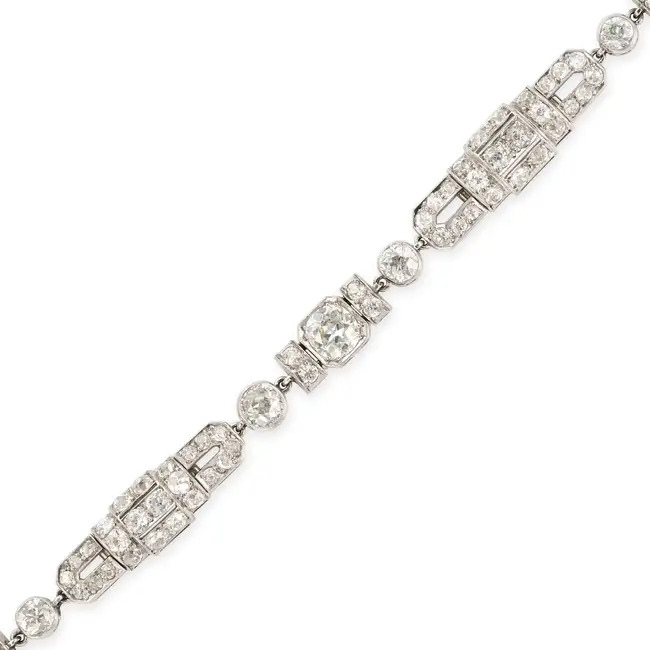 A FINE ART DECO DIAMOND BRACELET comprising a series of geometric links set throughout with old