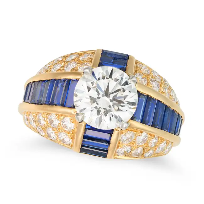 OSCAR HEYMAN, A FINE DIAMOND AND SAPPHIRE DRESS RING set with a round brilliant cut diamond of 2.