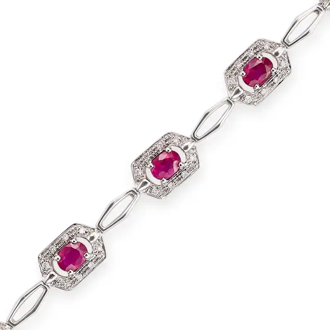 A RUBY AND DIAMOND BRACELET comprising a row of fancy links, set with oval cut rubies accented by