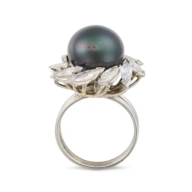 GRIMA, A VINTAGE NATURAL SALTWATER PEARL AND DIAMOND DRESS RING in platinum, set with a black