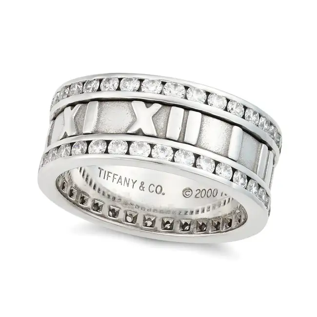 TIFFANY & CO., A DIAMOND ATLAS FULL ETERNITY RING the band ring embossed with Roman numerals, set