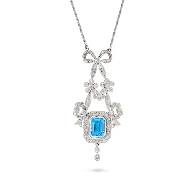 A BLUE TOPAZ AND DIAMOND PENDANT NECKLACE the pendant set with octagonal step cut blue topaz
