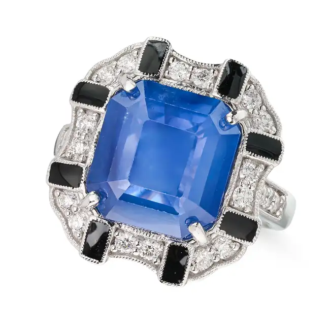 A CEYLON SAPPHIRE, DIAMOND AND ENAMEL RING set with an octagonal step cut sapphire of 6.86 carats,