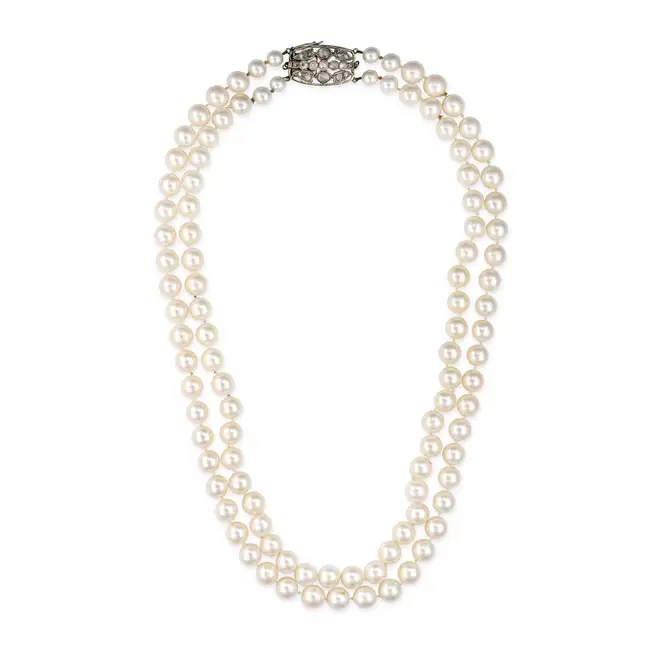 A TWO ROW PEARL AND DIAMOND NECKLACE comprising two rows of pearls of 6.4mm-8.9mm, the antique clasp