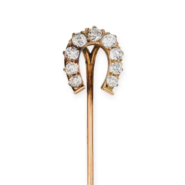TIFFANY & CO., AN ANTIQUE DIAMOND HORSESHOE STICK / TIE PIN, EARLY 20TH CENTURY designed as a