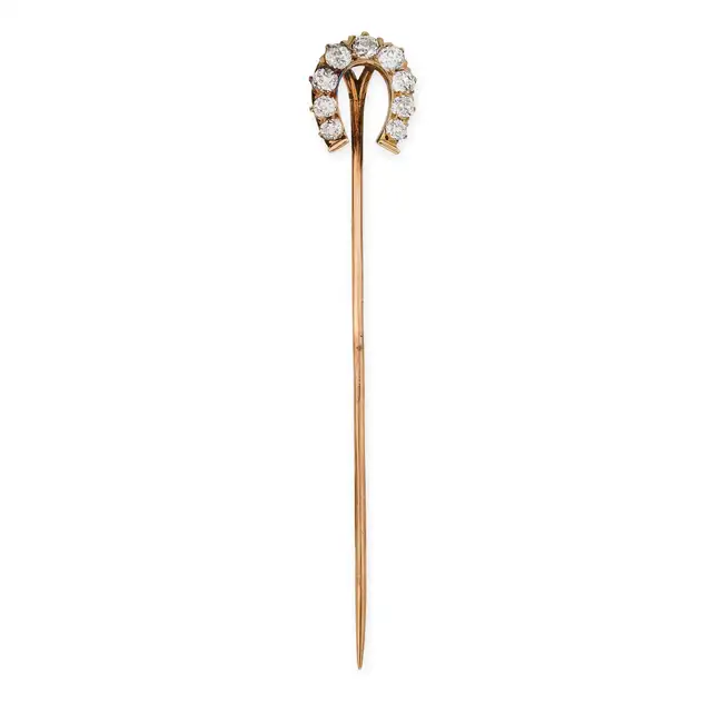 TIFFANY & CO., AN ANTIQUE DIAMOND HORSESHOE STICK / TIE PIN, EARLY 20TH CENTURY designed as a