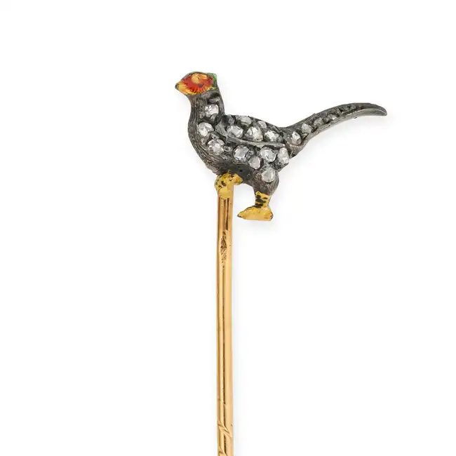 AN ANTIQUE DIAMOND AND ENAMEL PHEASANT STICK / TIE PIN designed as a pheasant set with rose cut