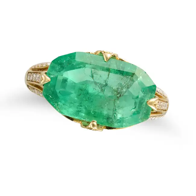 A 6.39 CARAT COLOMBIAN EMERALD RING set with an octagonal step cut emerald of 6.39 carats, the