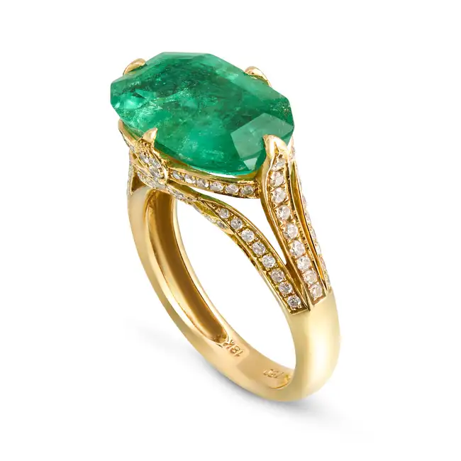 A 6.39 CARAT COLOMBIAN EMERALD RING set with an octagonal step cut emerald of 6.39 carats, the