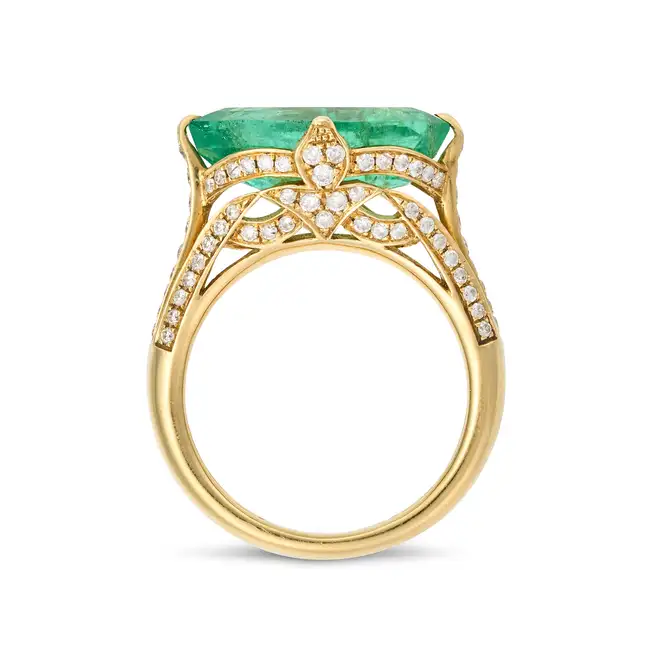 A 6.39 CARAT COLOMBIAN EMERALD RING set with an octagonal step cut emerald of 6.39 carats, the