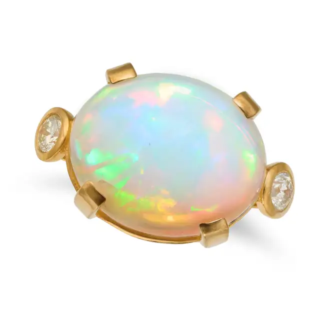 A LARGE OPAL AND DIAMOND RING set with an oval cabochon opal of approximately 28.01 carats, accented