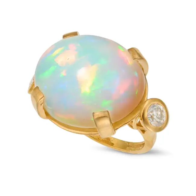A LARGE OPAL AND DIAMOND RING set with an oval cabochon opal of approximately 28.01 carats, accented