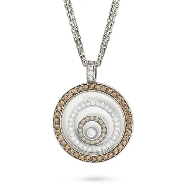 CHOPARD, A CHAMPAGNE DIAMOND HAPPY SPIRIT NECKLACE the circular pendant comprising a locket with a