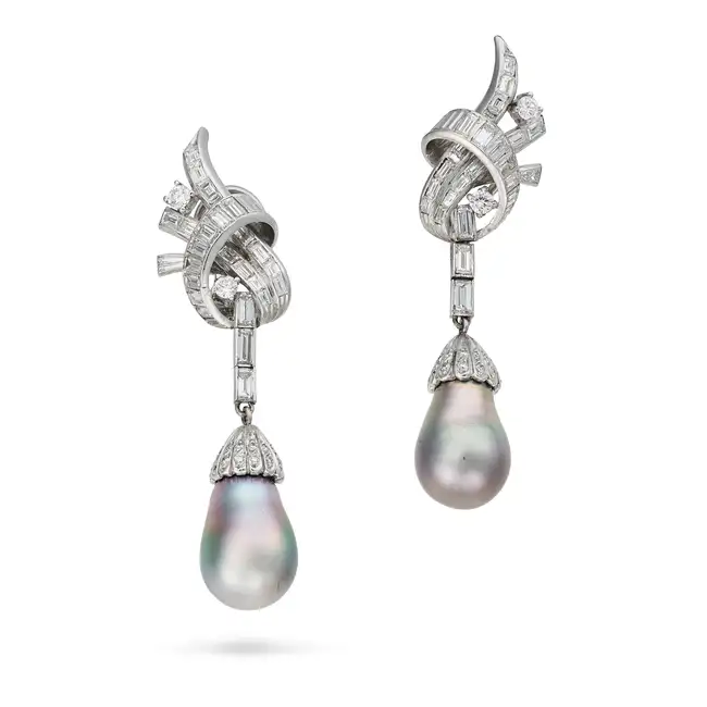 A PAIR OF MID CENTURY BLACK PEARL AND DIAMOND DROP EARRINGS each in scrolling design, set with round