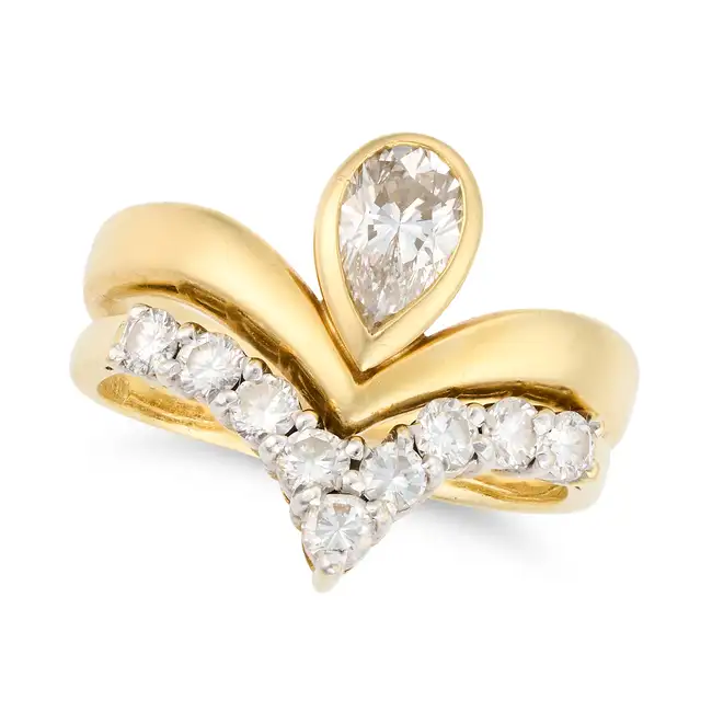 A SOLITAIRE DIAMOND RING AND BAND comprising a solitaire diamond ring set with a pear cut diamond of