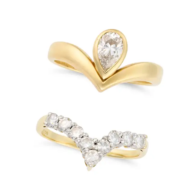 A SOLITAIRE DIAMOND RING AND BAND comprising a solitaire diamond ring set with a pear cut diamond of