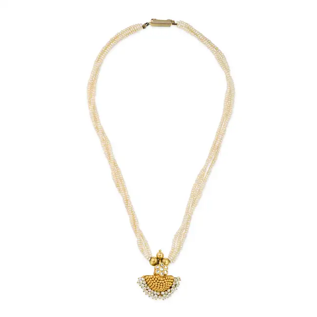 AN INDIAN PEARL PENDANT NECKLACE the pendant comprising gold beads, accented by a fringe of pearls
